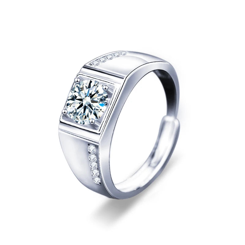 Silver ring with a large central gemstone and smaller stones on a white background