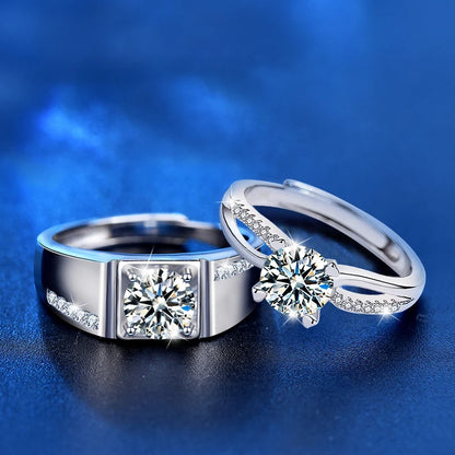 Two silver rings with diamond stones on a blue background