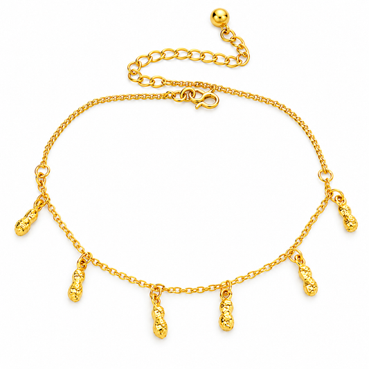 A gold chain anklet featuring five dangling textured cylindrical charms, displayed on a clean white background.
